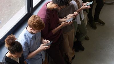 People on their phone in an office